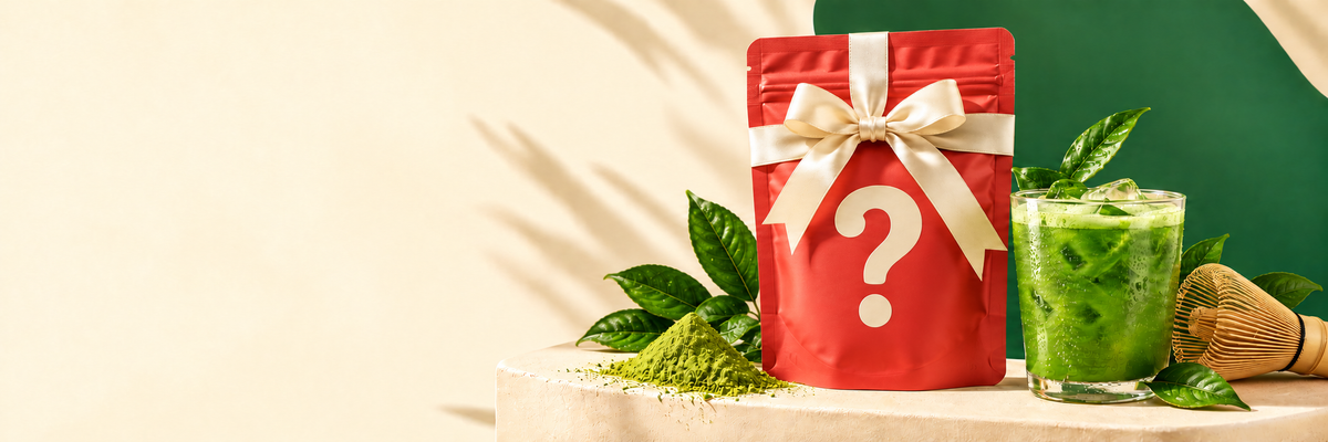 A mystery matcha gift with iced matcha and a bamboo whisk